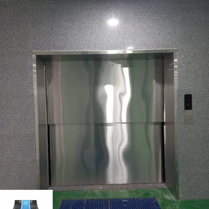 Thang Máy Tải Hàng Cửa Inox Tự Động Mở Lên